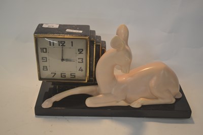 Lot 475 - An Art Deco style mantel clock in a ceramic...