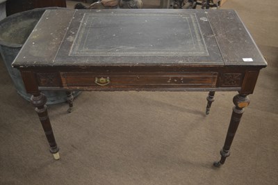 Lot 487 - A late 19th Century writing table with tooled...