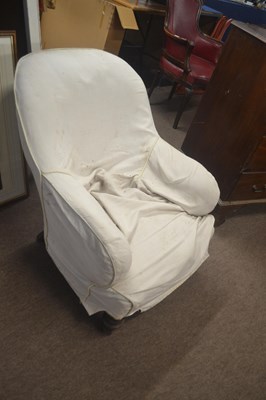 Lot 489 - A Victorian low armchair raised on turned legs,...