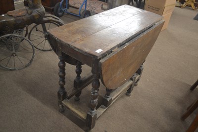 Lot 490 - An 18th Century oak gateleg table of typical...