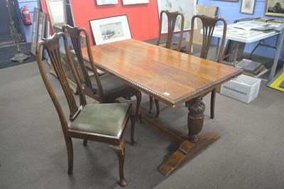 Lot 495 - A small 20th Century oak refectory type dining...
