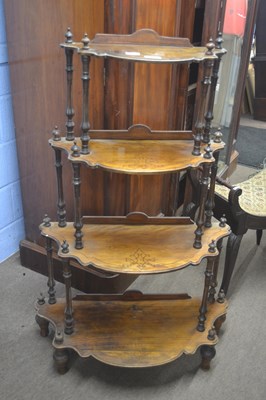 Lot 501 - A Victorian bow front four tier what-not on...