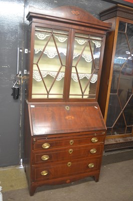 Lot 511 - A Georgian mahogany bureau bookcase cabinet,...