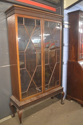 Lot 512 - An Edwardian bookcase cabinet in the Georgian...