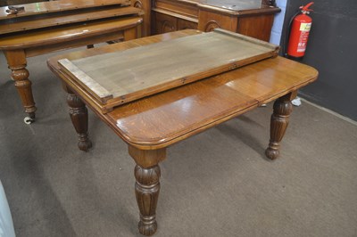Lot 514 - A late Victorian oak extending dining table...