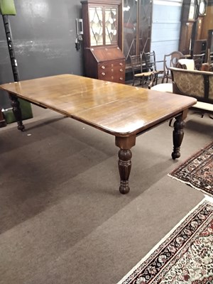Lot 514 - A late Victorian oak extending dining table...