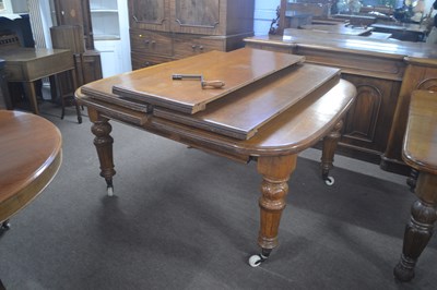 Lot 515 - A Victorian light oak extending dining table...