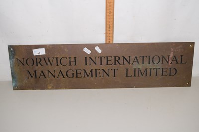 Lot 42 - A brass plaque marked Norwich International...