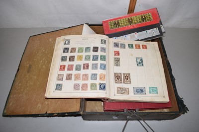 Lot 81 - A box file containing three stamp albums...