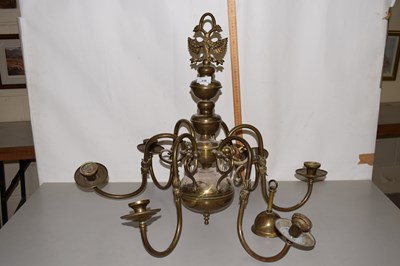 Lot 218 - A brass six branch candelabra