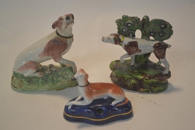 Lot 339 - A small pearl ware model of a retriever...