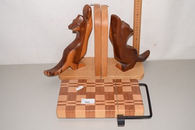 Lot 502 - A pair of wooden bookends and a cheese board...