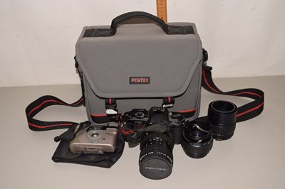 Lot 514 - A Pentax P30 and lens together with additional...