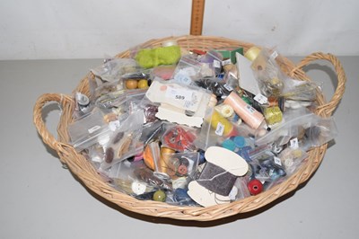 Lot 589 - A basket of buttons and haberdashery accessories