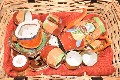 Lot 634 - A picnic hamper and a small Japanese tea set