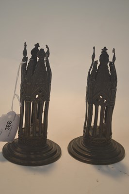 Lot 388 - Pair of metal candlesticks modelled in...