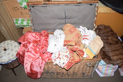 Lot 777 - A wicker hamper and assorted textiles