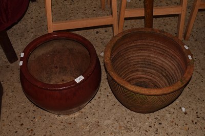 Lot 272 - A red glazed plant pot and a further...