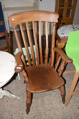 Lot 284 - A Victorian elm seated Windsor chair