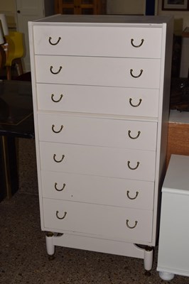 Lot 303 - A retro painted G-Plan narrow seven drawer...