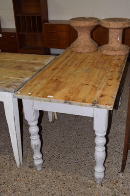 Lot 328 - A pine kitchen table on turned legs