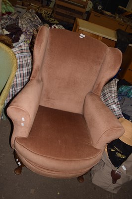 Lot 837 - A wingback armchair