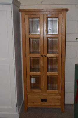 Lot 258 - Modern light oak bookcase cabinet with drawer...