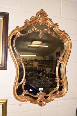 Lot 265 - A reproduction gilt framed wall mirror