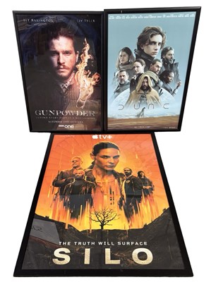 Lot 154 - Three framed film and TV advertising posters,...