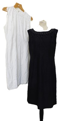 Lot 47 - Two beaded shift dresses: including a black...