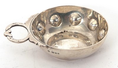 Lot 13 - An Elizabeth II silver wine taster, heavy...