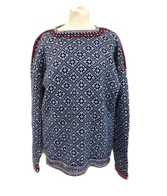Lot 170 - A unisex hand knitted sweater, in navy and...