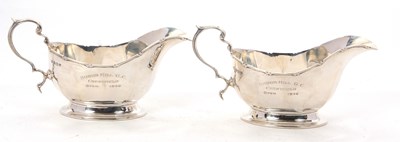 Lot 50 - A pair of George V silver sauce boats having...
