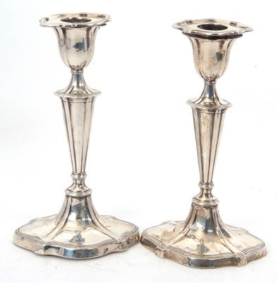 Lot 51 - A pair of late Victorian silver candlesticks...