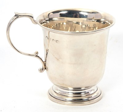 Lot 53 - A hallmarked silver mug of plain polished form...