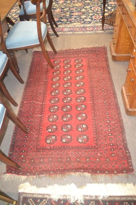 Lot 539 - A Bokhara red floor rug decorated with a...