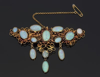 Lot 289 - An opal brooch / pendant, the wirework frame...