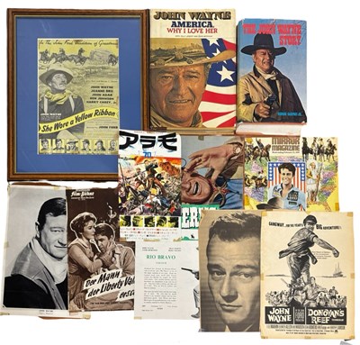Lot 136 - JOHN WAYNE: A collection of books and ephemera...