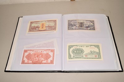 Lot 63 - An album of 20th Century world bank notes,...