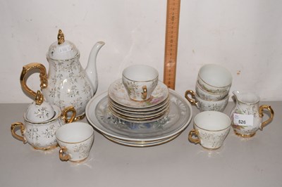Lot 526 - A gilt and floral decorated tea set