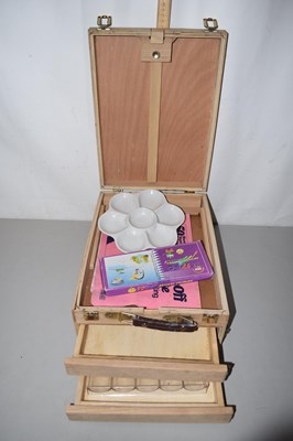 Lot 597 - A folding artists easel and contents