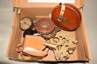 Lot 639 - Box of assorted tape measures, sextant and...