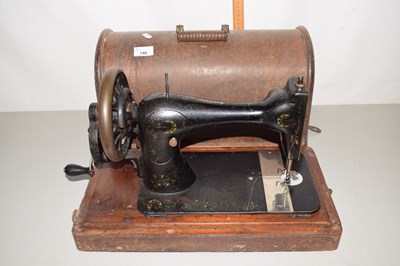 Lot 148 - A cased vintage sewing machine