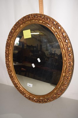 Lot 159 - Oval wall mirror in a pierced gilt finish frame
