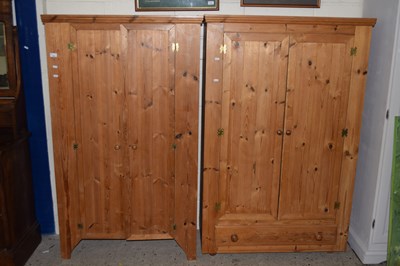Lot 194 - A pair of small pine double door wardrobes
