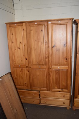 Lot 715 - A pine triple wardrobe