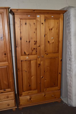 Lot 716 - A pine double wardrobe