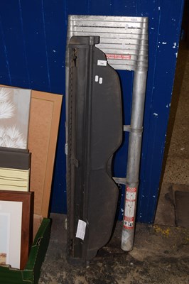 Lot 794 - An extending ladder and a car parcel shelf