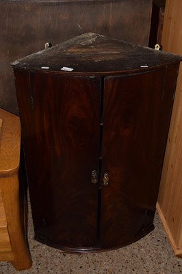Lot 234 - Mahogany bow front cupboard