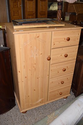 Lot 235 - Pine cupboard and drawer combination
